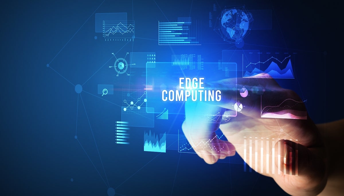 Hand touching EDGE COMPUTING inscription, new business technology concept.